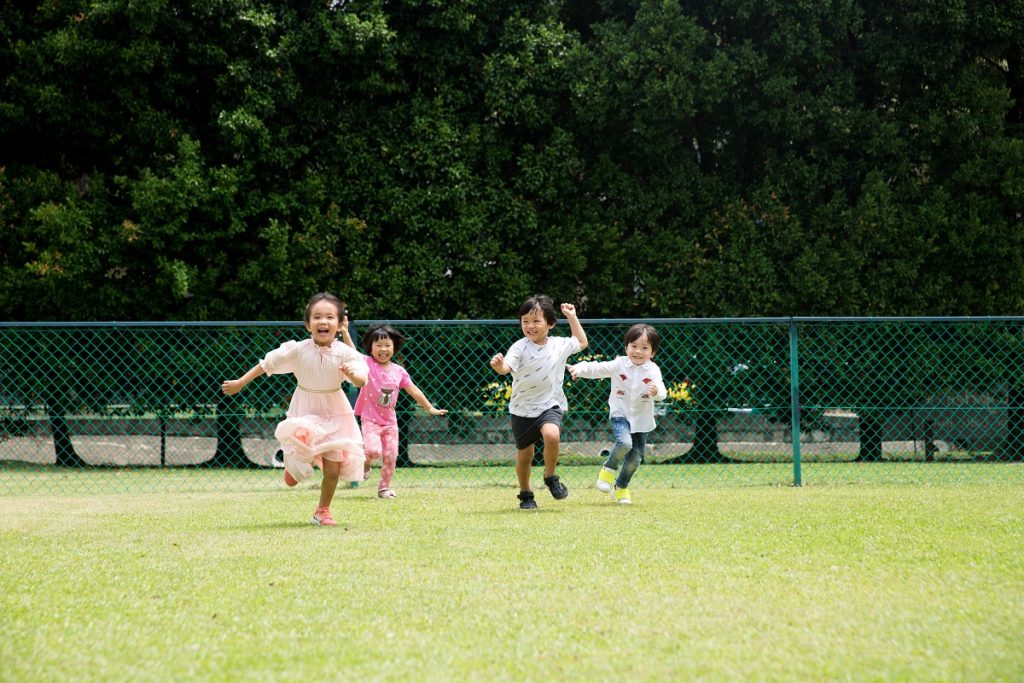 children running in a field