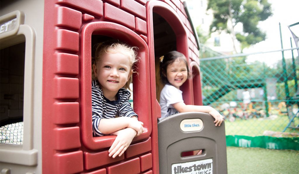 Two preschoolers having fun