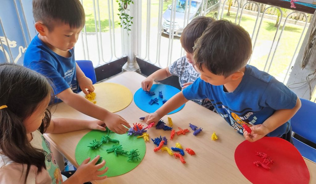 Preschoolers sorting shapes and colours