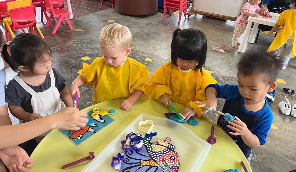 A group of preschoolers doing craftwork