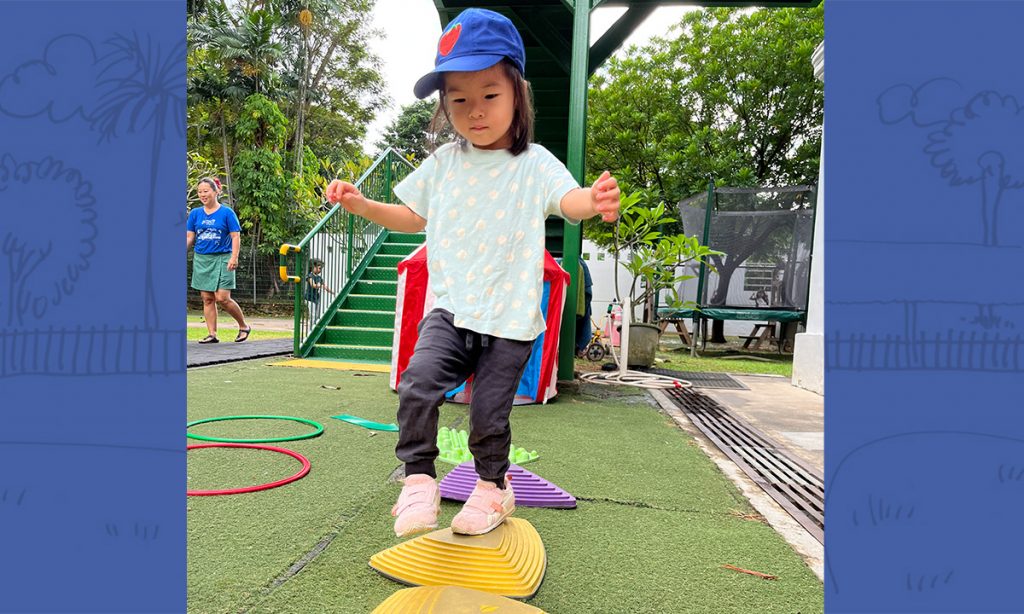 Preschooler doing an obstacle course