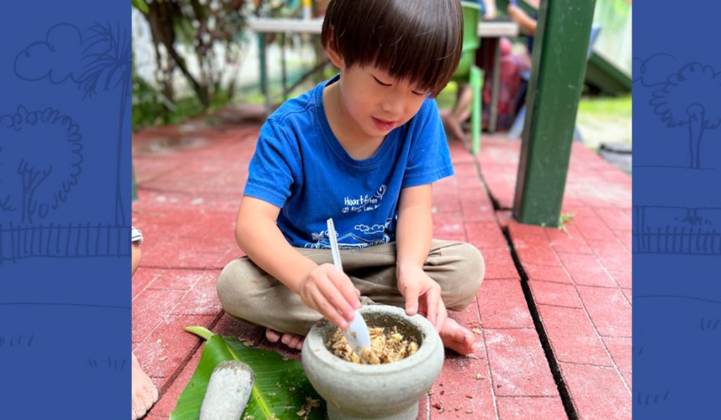preschooler engaged in a sensory outdoor activity
