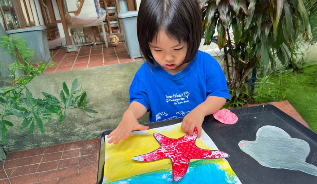 preschooler exploring colours and shapes